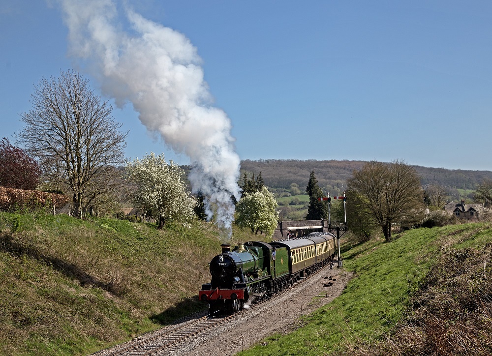 Hall class 7903 Foremarke Steam train pulling away from Winchcombe station with a Cheltenham-bound service along the Gloucestershire Warwickshire Railway