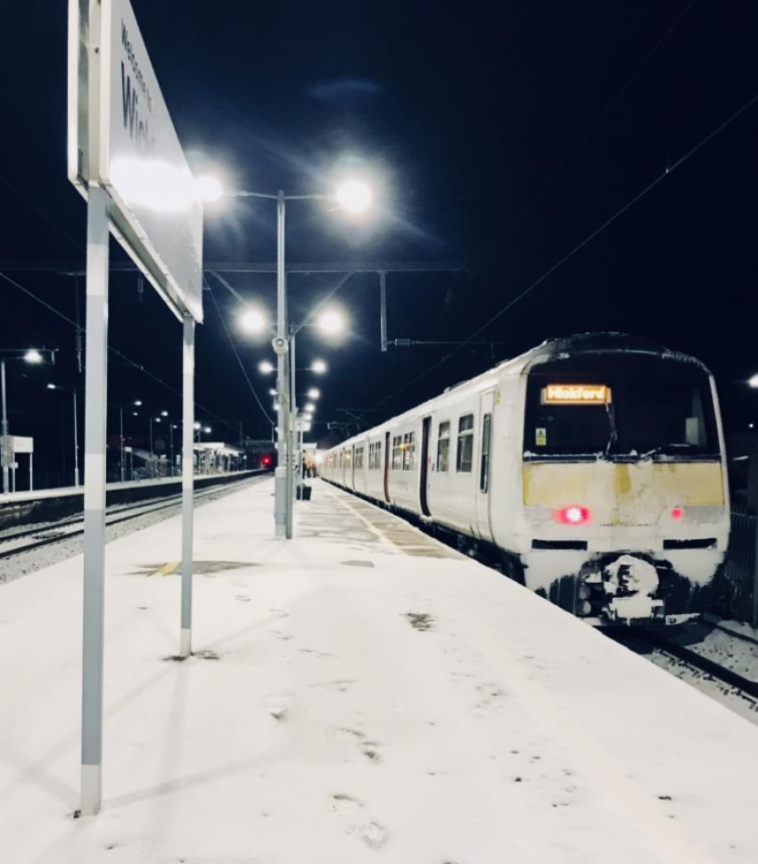 Wickford Station platform and train covered in snow