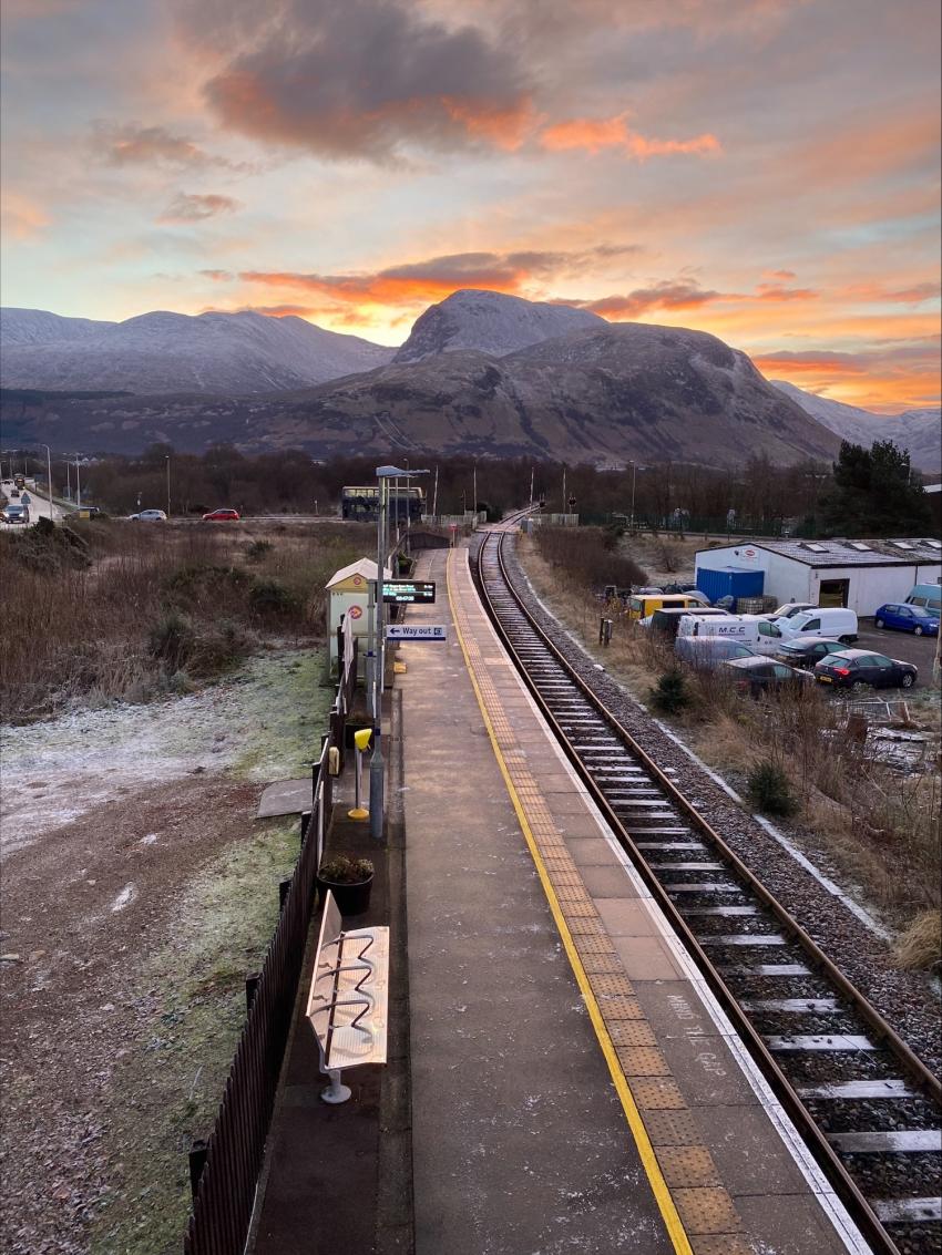 Sunrise over Ben Nevis with railway track in foreground