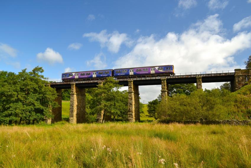 Train crossing Clapham Viaduct along the Bentham Line. Yorkshire & North East UK