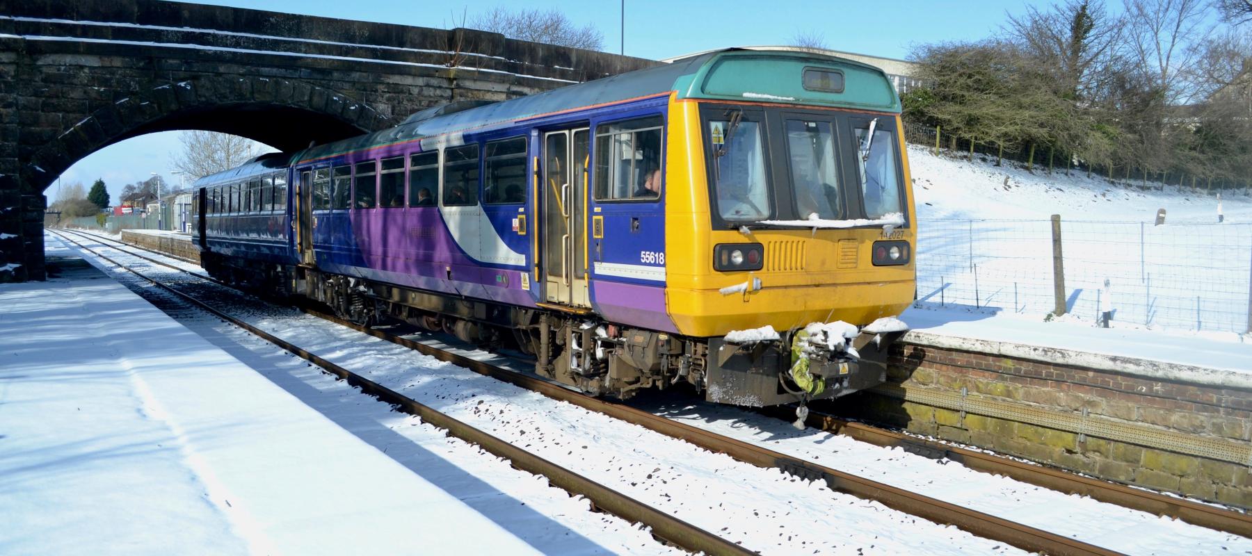 Train heading to Leeds through snowy countryside