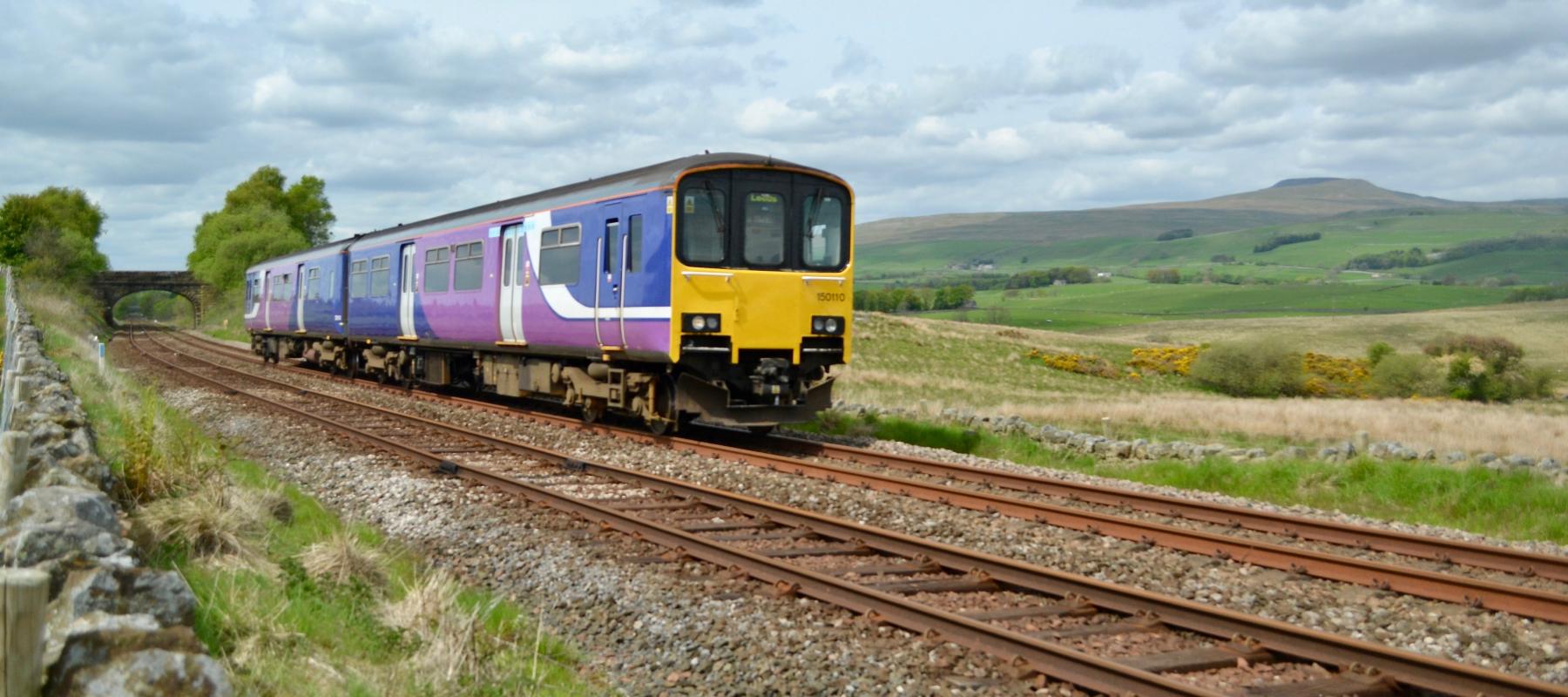 Bentham Line train travelling through the countryside