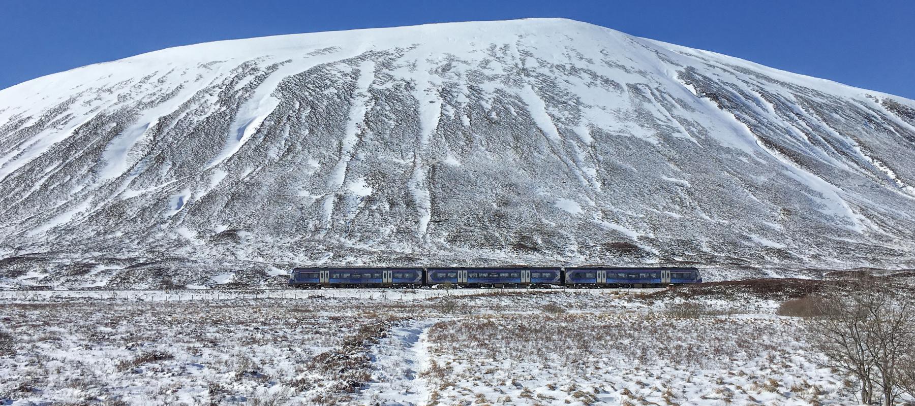 Train travelling through the Drumochter Pass