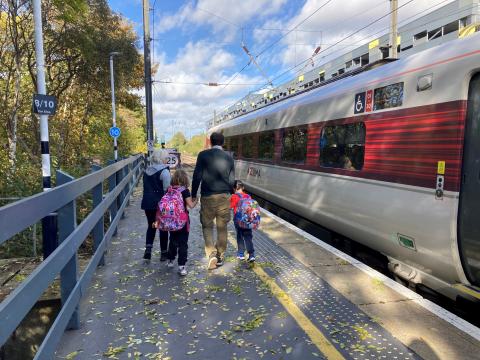 Family and train at platform