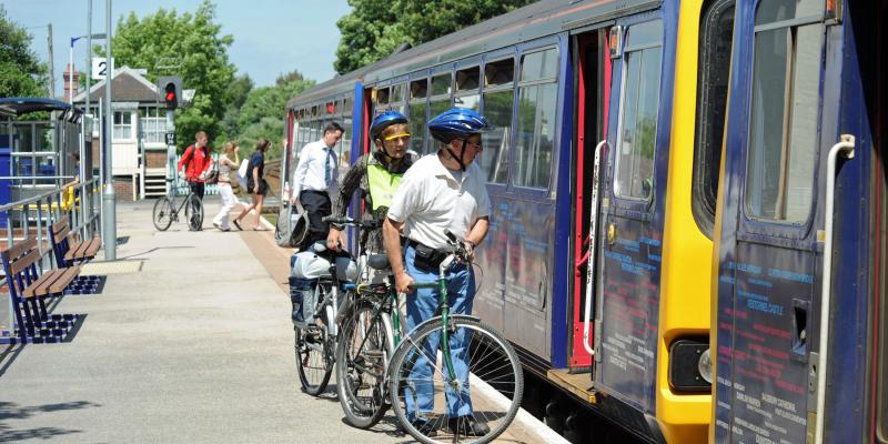 Cyclists boarding train at Topsham Station, on the Avocet Line