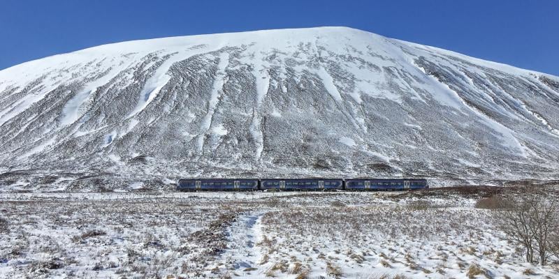 Train travelling through the Drumochter Pass