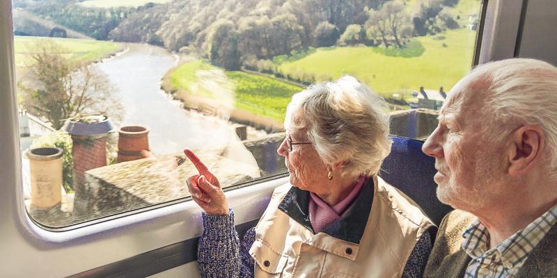 Older couple point at views from Calstock Viaduct on the Tamar Valley Line