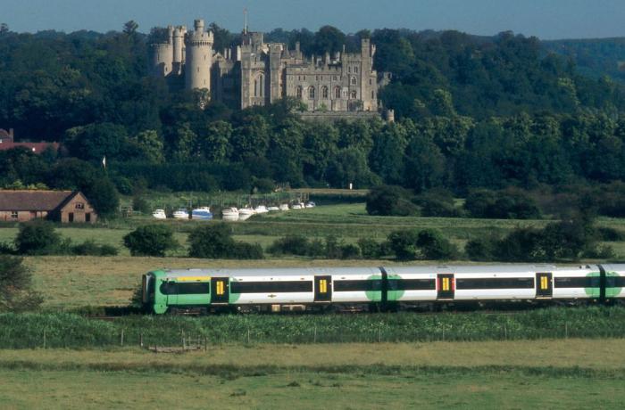 Arundel Castle with a train travelling along the Arun Valley Line